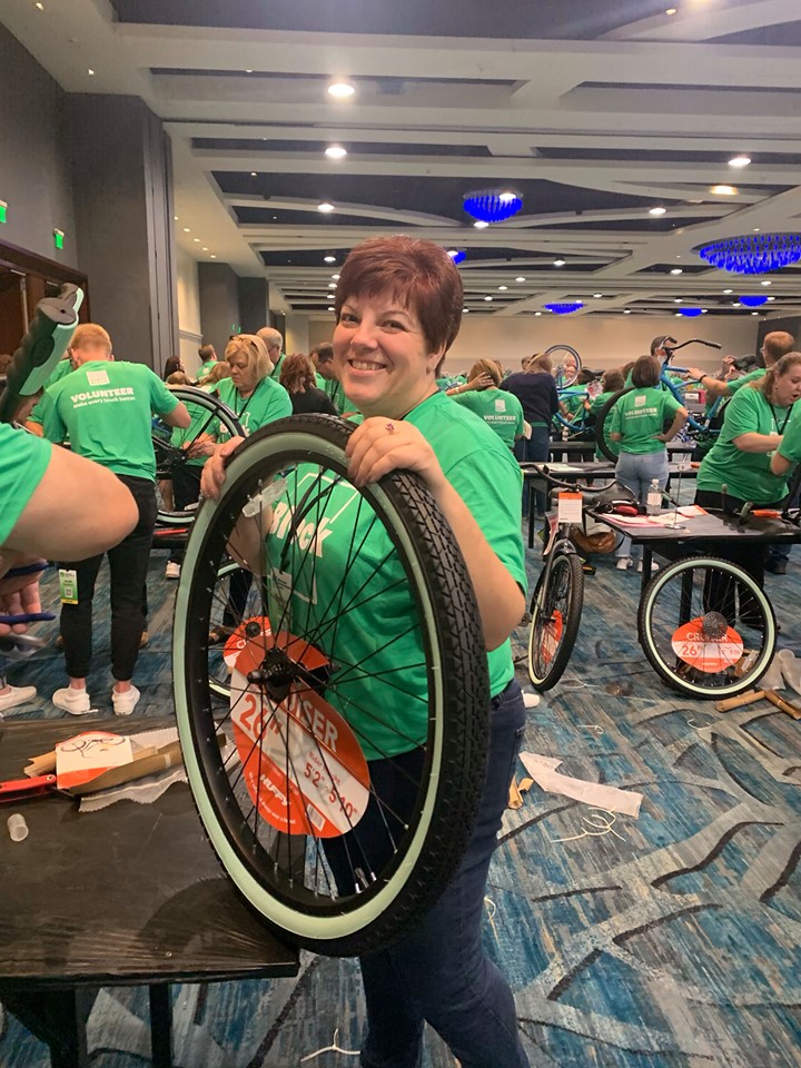 An HR Block employee building a bike a Heart of Florida United Way's Bike Build