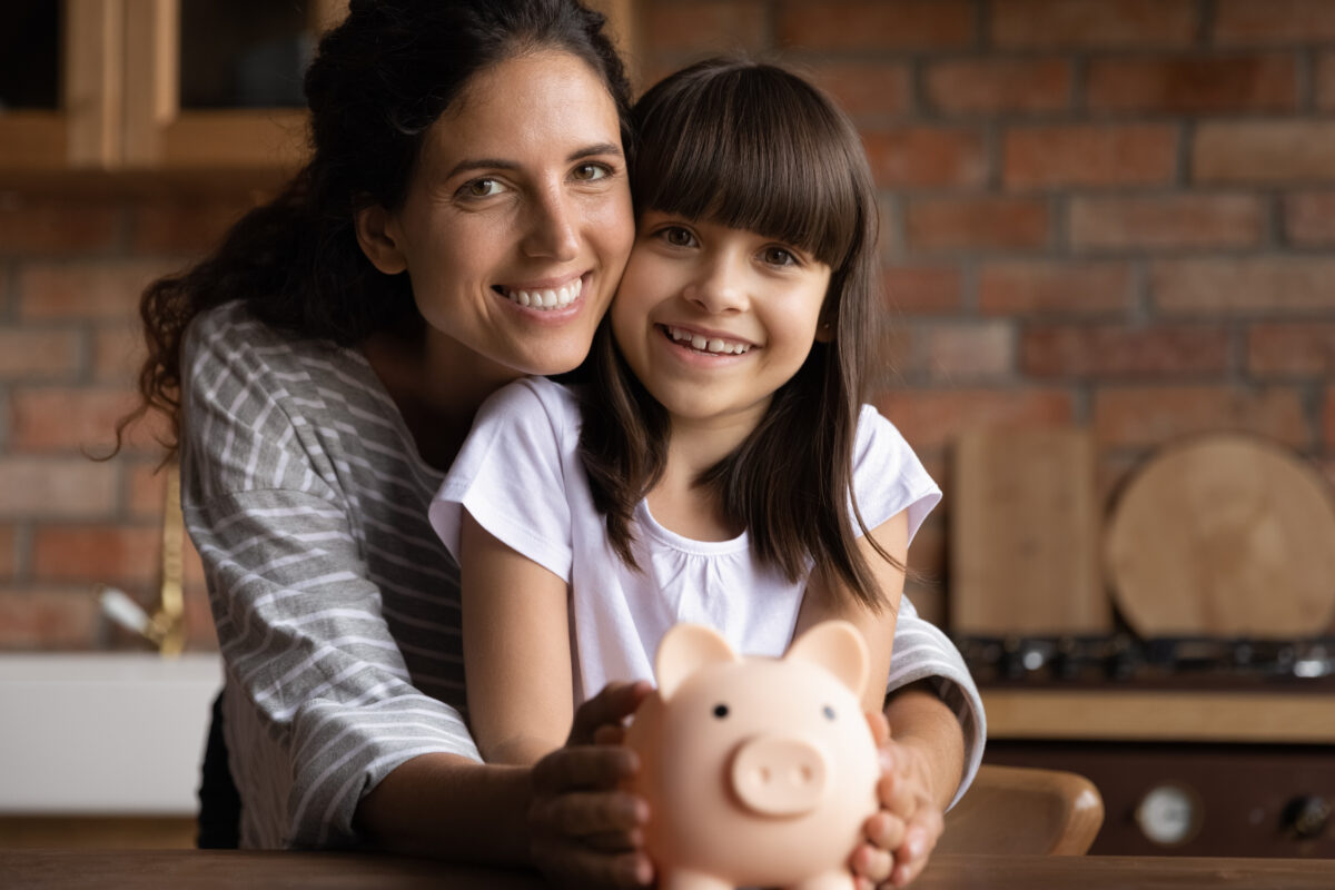 Mom, daughter, piggybank