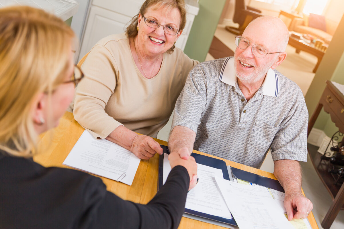 Older couple completing paperwork