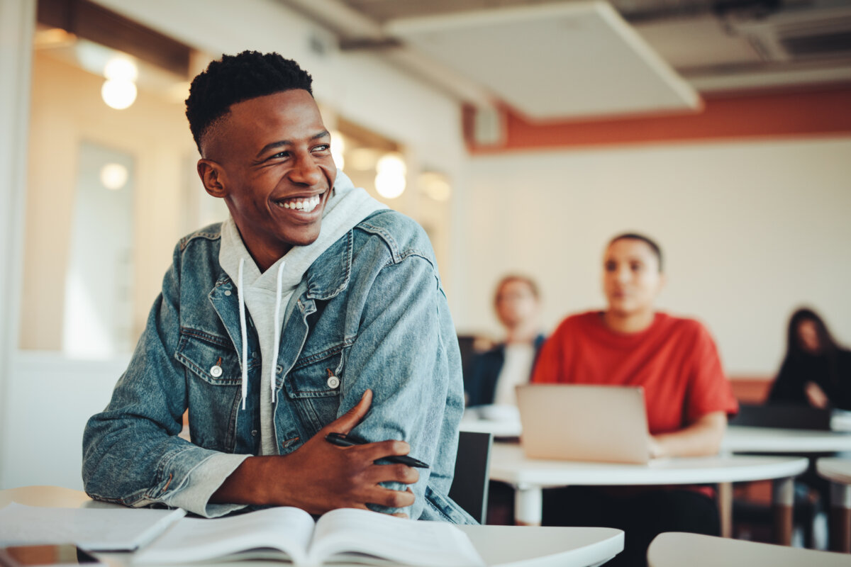 Young adult male student in class