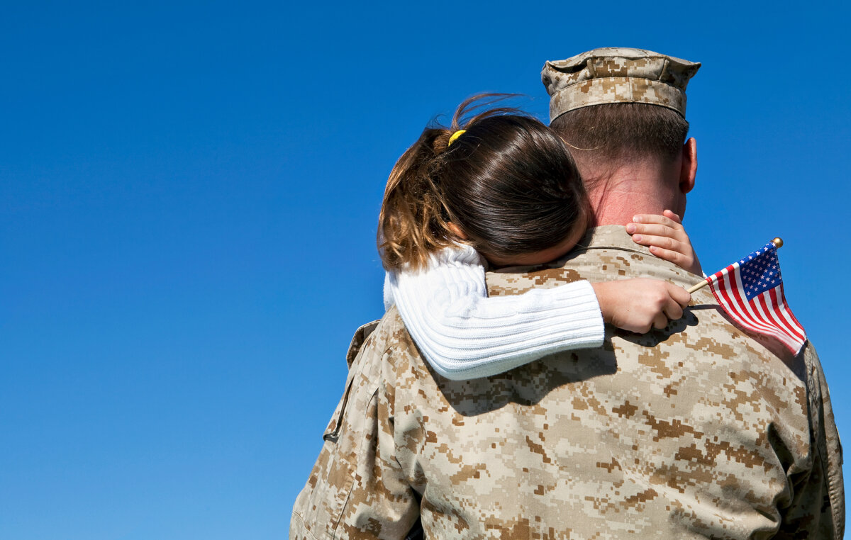 Military Man Hugging His Daughter