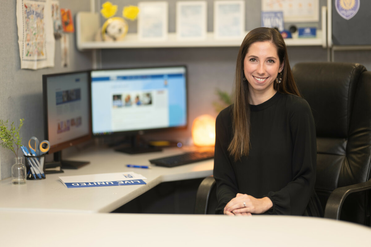 Business United 7 HFUW staff member at desk