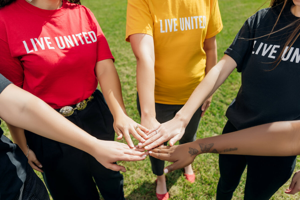 Live United hands in a circle