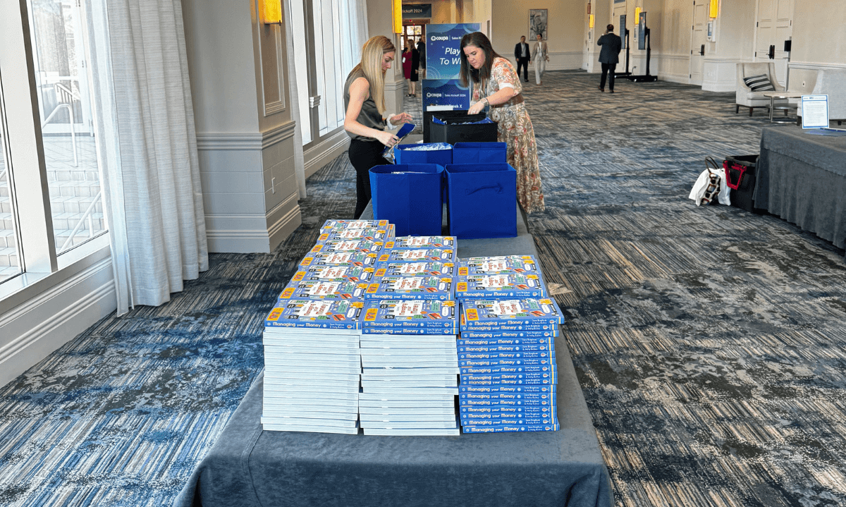 Volunteers assembling Financial Literacy Kits